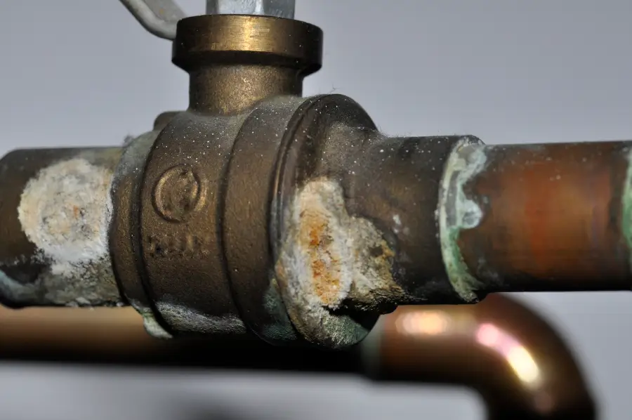 Corroded pipe fittings with mineral buildup, one of the plumbing issues West Columbia sewer inspections uncover